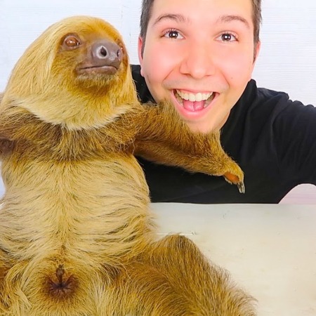 Nikocado Avocado showing his pet Sloth.
